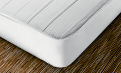 What is a mattress protector and what is it used for?